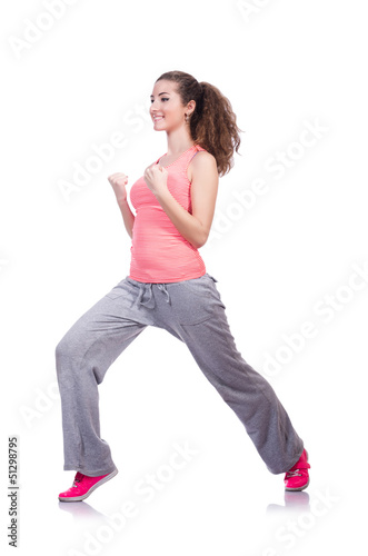 Photo: Young female doing exercises on white Young female doing exercises on white