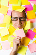 Photo: Businesswoman with lots of reminder notes Businesswoman with lots of reminder notes