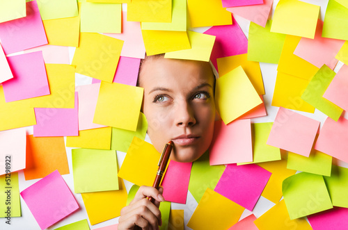 Photo: Businesswoman with lots of reminder notes Businesswoman with lots of reminder notes