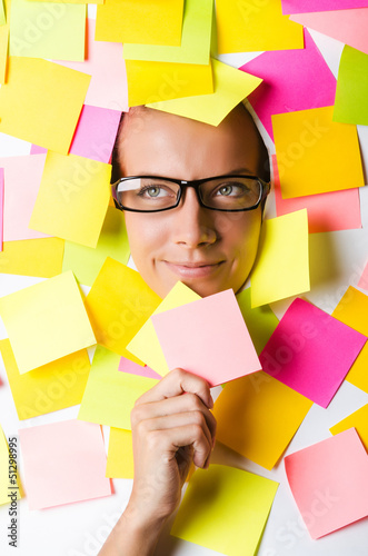 Photo: Businesswoman with lots of reminder notes Businesswoman with lots of reminder notes
