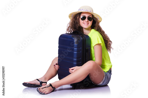 Photo: Young woman with suitcase on white Young woman with suitcase on white