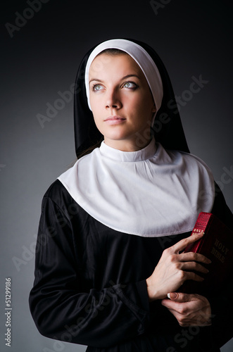 Photo: Young nun in religious concept Young nun in religious concept