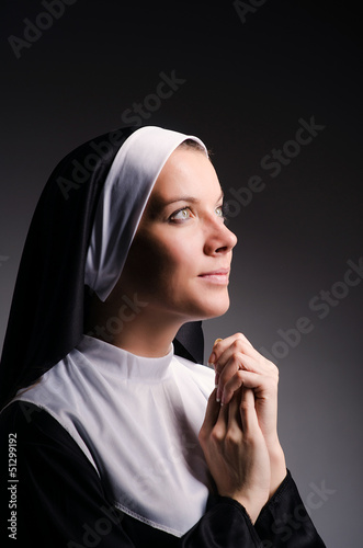 Photo: Young nun in religious concept Young nun in religious concept