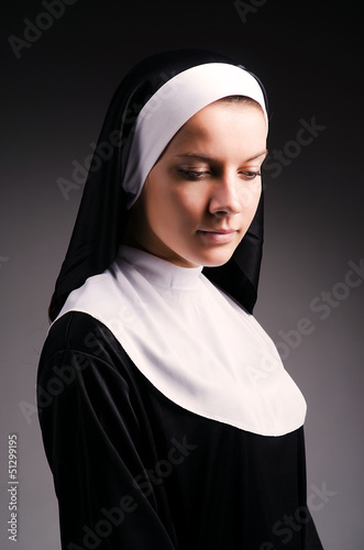 Photo: Young nun in religious concept Young nun in religious concept