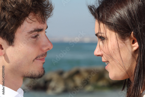 Photo: Close up of a couple looking each other with love Close up of a couple looking each other with love