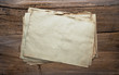 Photo: old papers on wooden background old papers on wooden background