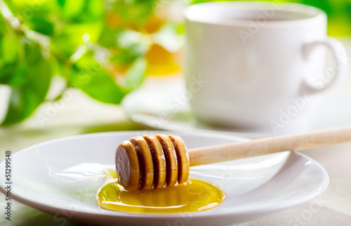 Photo: honey and cup of tea honey and cup of tea