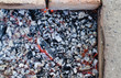 Glowing hot coals in an open fireplace