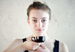 friendly young Model with a Coffee Cup