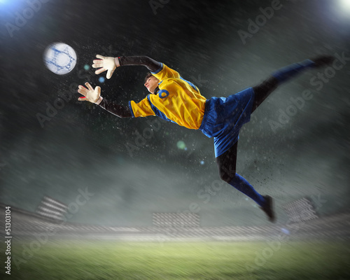 Photo: Goalkeeper catches the ball Goalkeeper catches the ball