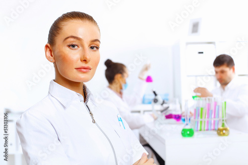 Photo: Young female doctor in white uniform Young female doctor in white uniform