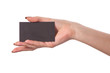 Businesswoman's hand holding blank business card