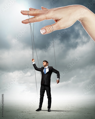 Photo: Business man marionette Business man marionette