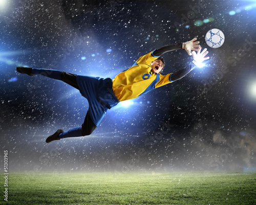 Photo: Goalkeeper catches the ball Goalkeeper catches the ball