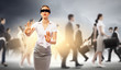 Businesswoman in blindfold among group of people