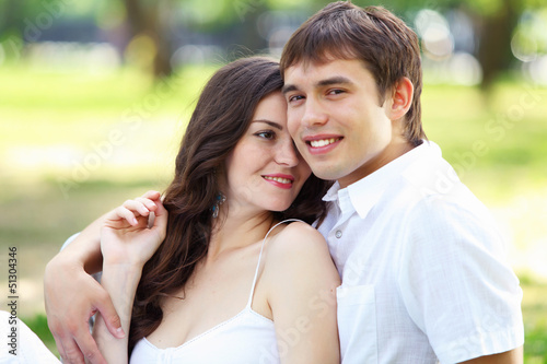 Photo: Young love Couple smiling under blue sky Young love Couple smiling under blue sky