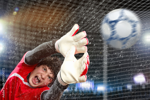 Photo: Goalkeeper catches the ball Goalkeeper catches the ball