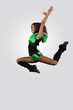 Young female dancer against white background