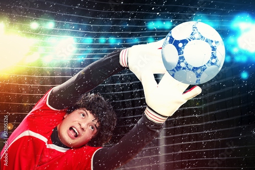 Photo: Goalkeeper catches the ball Goalkeeper catches the ball