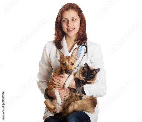 Photo: Woman vet with pets on a white background isolated Woman vet with pets on a white background isolated