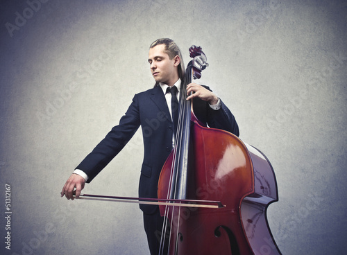 Photo: musician playing contrabass musician playing contrabass