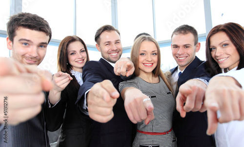 Photo: Happy diverse group of executives all pointing at you Happy diverse group of executives all pointing at you