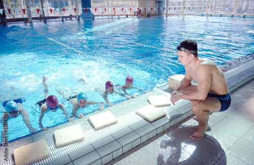 Photo: happy children group at swimming pool happy children group at swimming pool