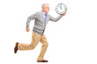 Foto: Full length portrait of a mature gentleman running and holding a Full length portrait of a mature gentleman running and holding a