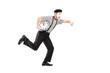 Full length portrait of a mime artist holding a clock and runnin