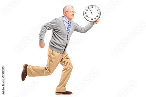 Photo: Full length portrait of a mature gentleman running and holding a Full length portrait of a mature gentleman running and holding a