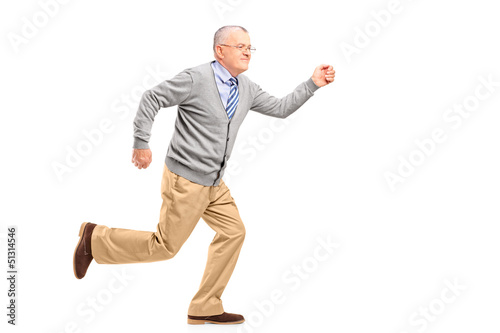Photo: Full length portrait of a mature gentleman running Full length portrait of a mature gentleman running
