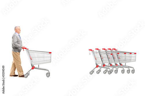 Photo: Full length portrait of a mature man returning an empty shopping Full length portrait of a mature man returning an empty shopping