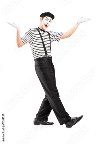 Photo: Full length portrait of a male mime dancer gesturing with hands Full length portrait of a male mime dancer gesturing with hands