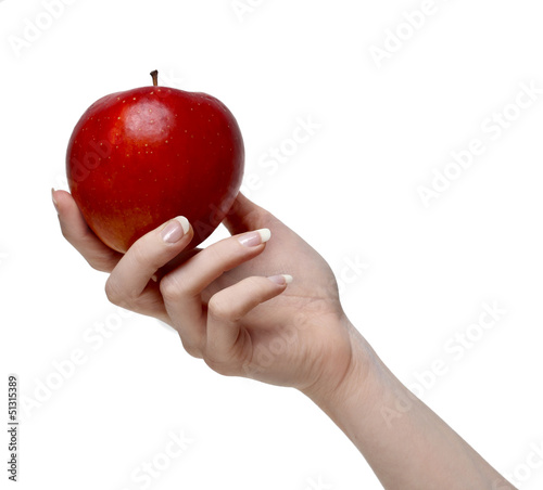 Photo: Red apple in beautiful hand isolated on white Red apple in beautiful hand isolated on white