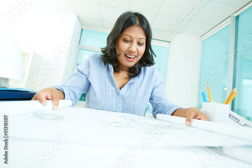 Photo: Looking at paper Looking at paper