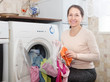 mature  woman uses bag for laundry