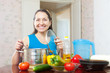 Happy mature woman with vegetables