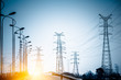 High voltage towers at sunset
