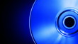 Video: Spinning blue compact disk on a black background (seamless loop) Spinning blue compact disk on a black background (seamless loop)