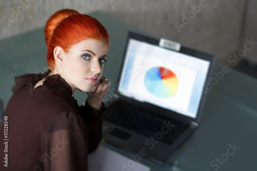 Photo: Young businesswoman with laptop Young businesswoman with laptop