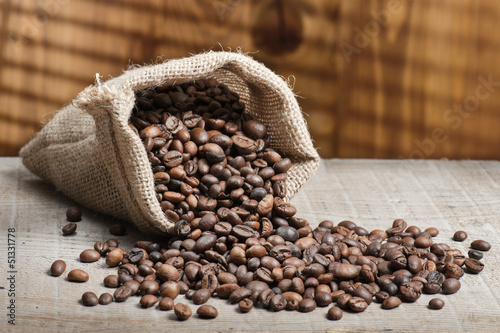 Photo: coffee beans on wooden table coffee beans on wooden table