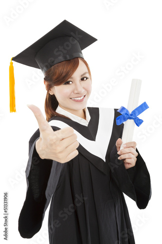 Photo: smiling Graduate woman with Degree and thumb up smiling Graduate woman with Degree and thumb up