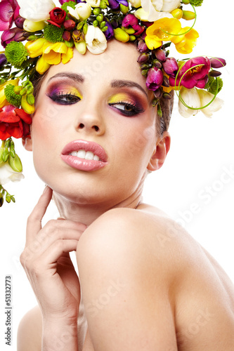 Photo: Woman with hairstyle and freesia flower. Isolated. Woman with hairstyle and freesia flower. Isolated.