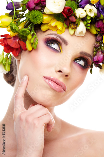 Photo: Woman with hairstyle and freesia flower. Isolated. Woman with hairstyle and freesia flower. Isolated.