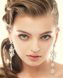 Jewelry. Gorgeous Exquisite Woman with Earrings. Refinement