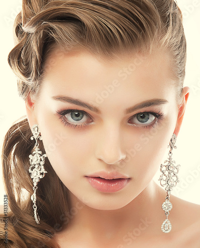 Photo: Jewelry. Gorgeous Exquisite Woman with Earrings. Refinement Jewelry. Gorgeous Exquisite Woman with Earrings. Refinement