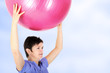 Sporty woman doing exercise with gym ball