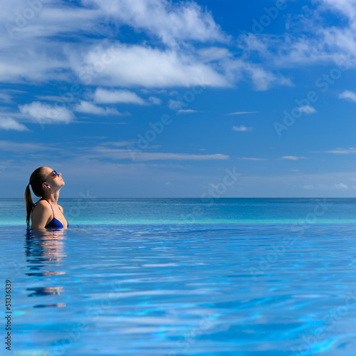 Photo: Woman at poolside Woman at poolside