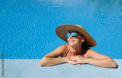 Photo: Woman at poolside Woman at poolside
