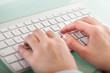 Hands Typing On Keyboard